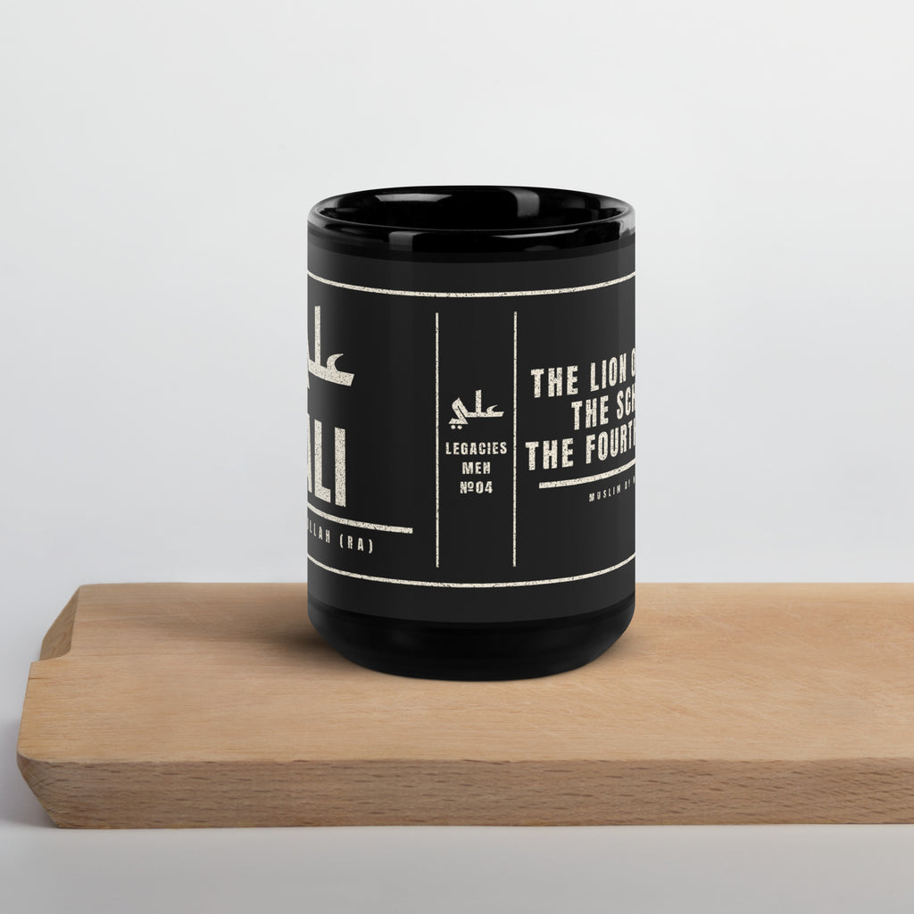 Muslim By Nature™ LEGACIES: MEN №04 Ali (RA) 15oz black mug – Kufic Arabic name and ALI in cream – front view